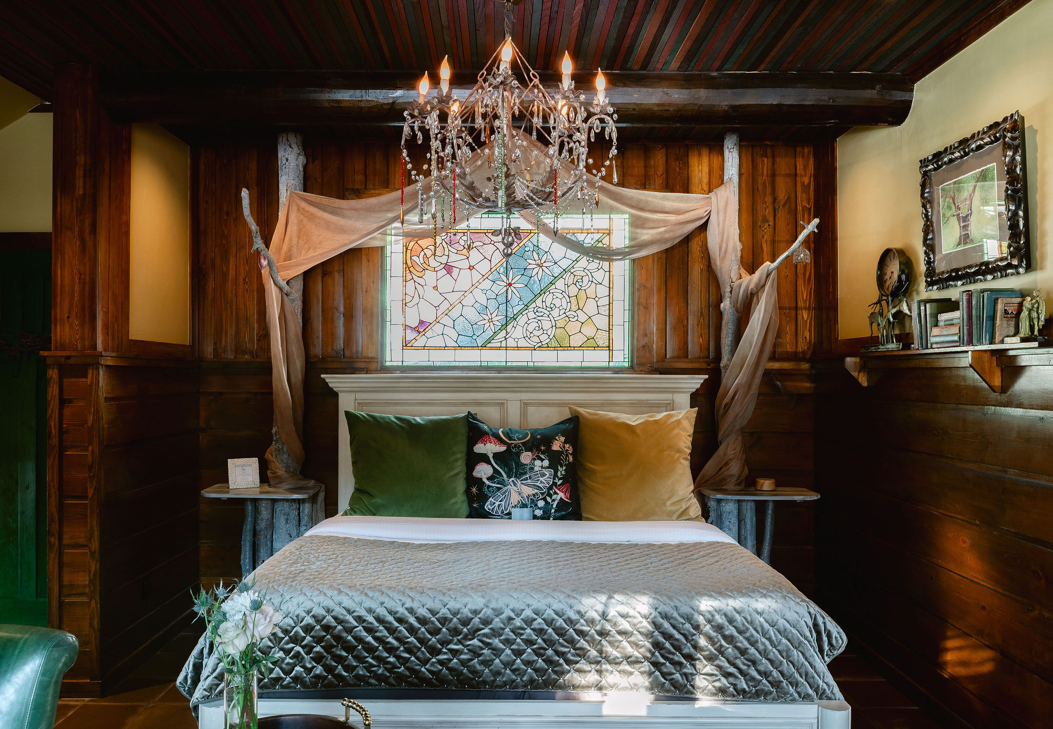 Brown tile floor, colorful beaded chandelier. tile floor, colorful stained glass