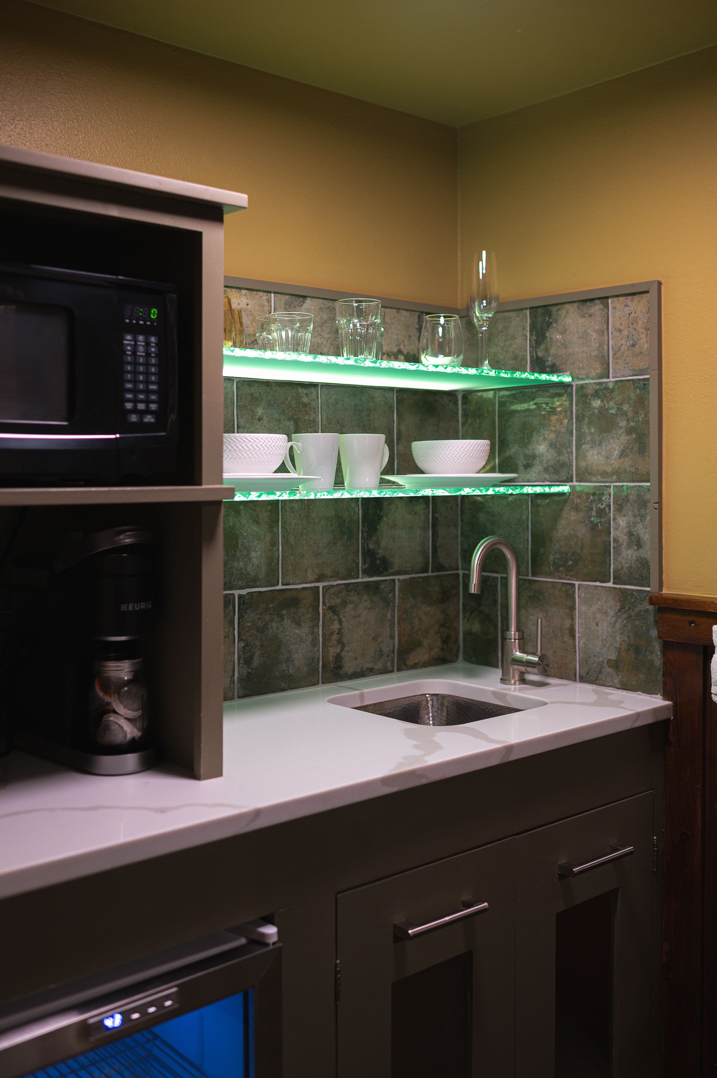 Wet bar kitchenette with mini fridge and microwave