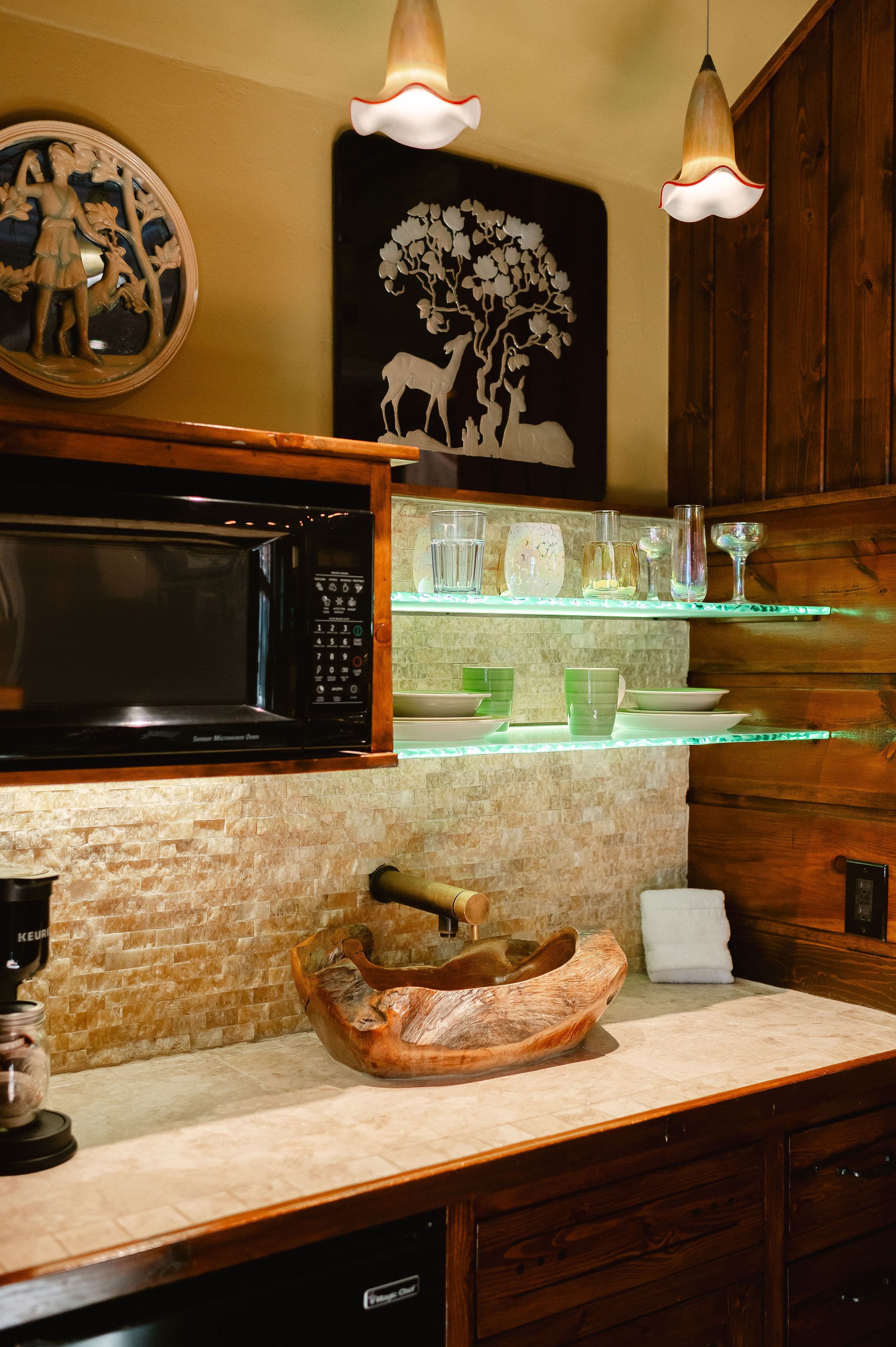 glass bar and wood sink, bird dishes and colorful glasses