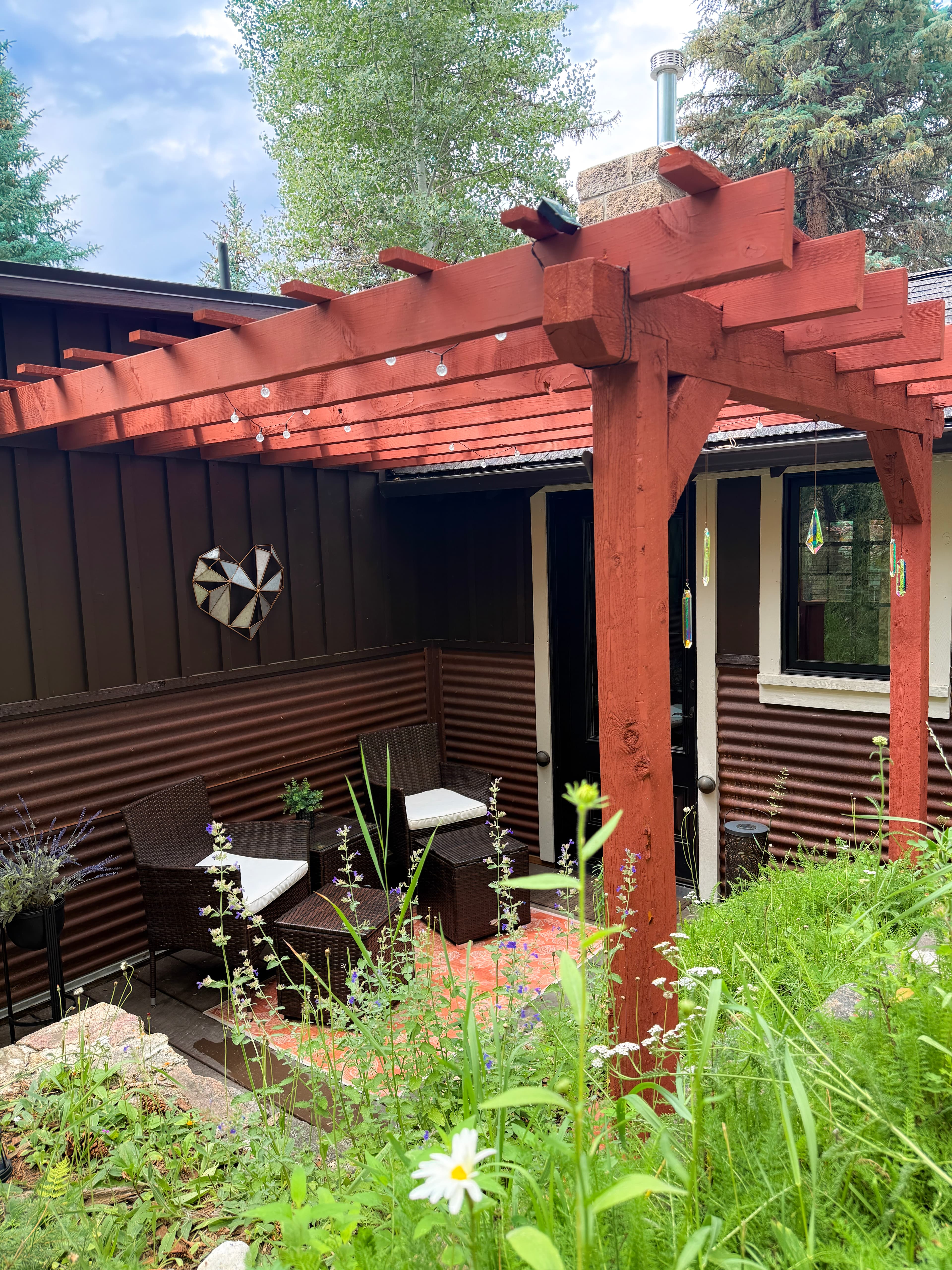 Private outdoor patio with two chairs and a small table
